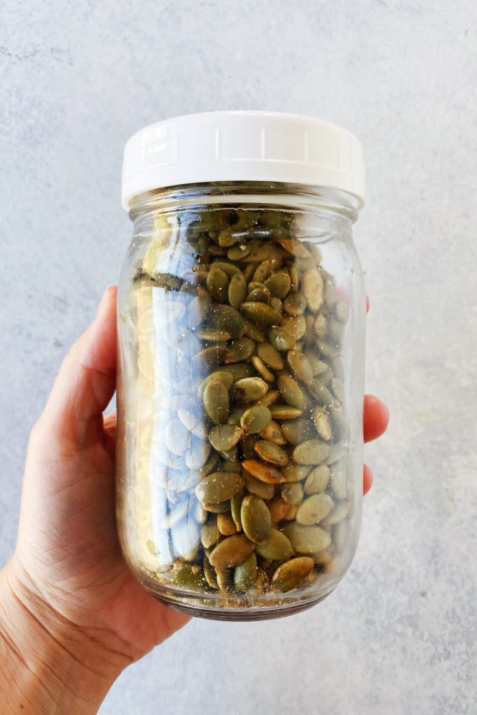 glass jar of pumpkin seeds