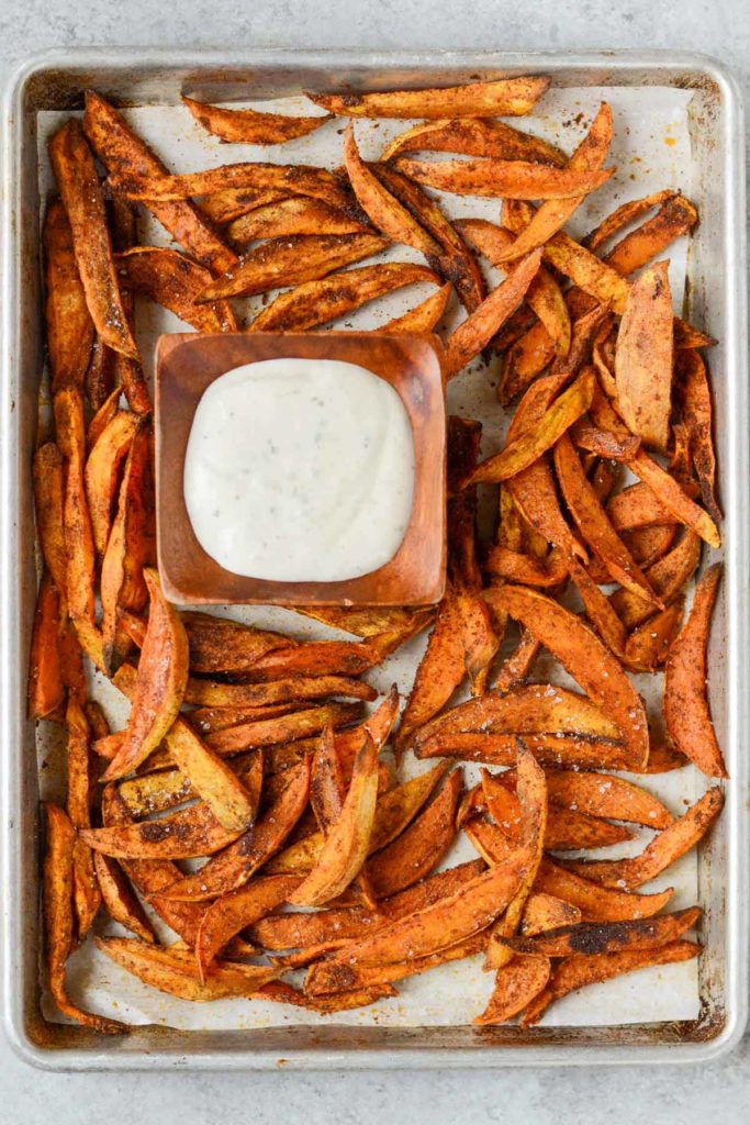 sheet pan crispy sweet potato fries with ranch dressing