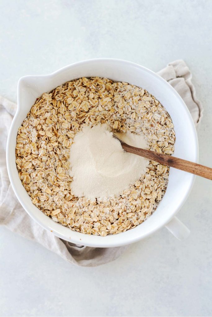 White bowl with oatmeal and other ingredients.