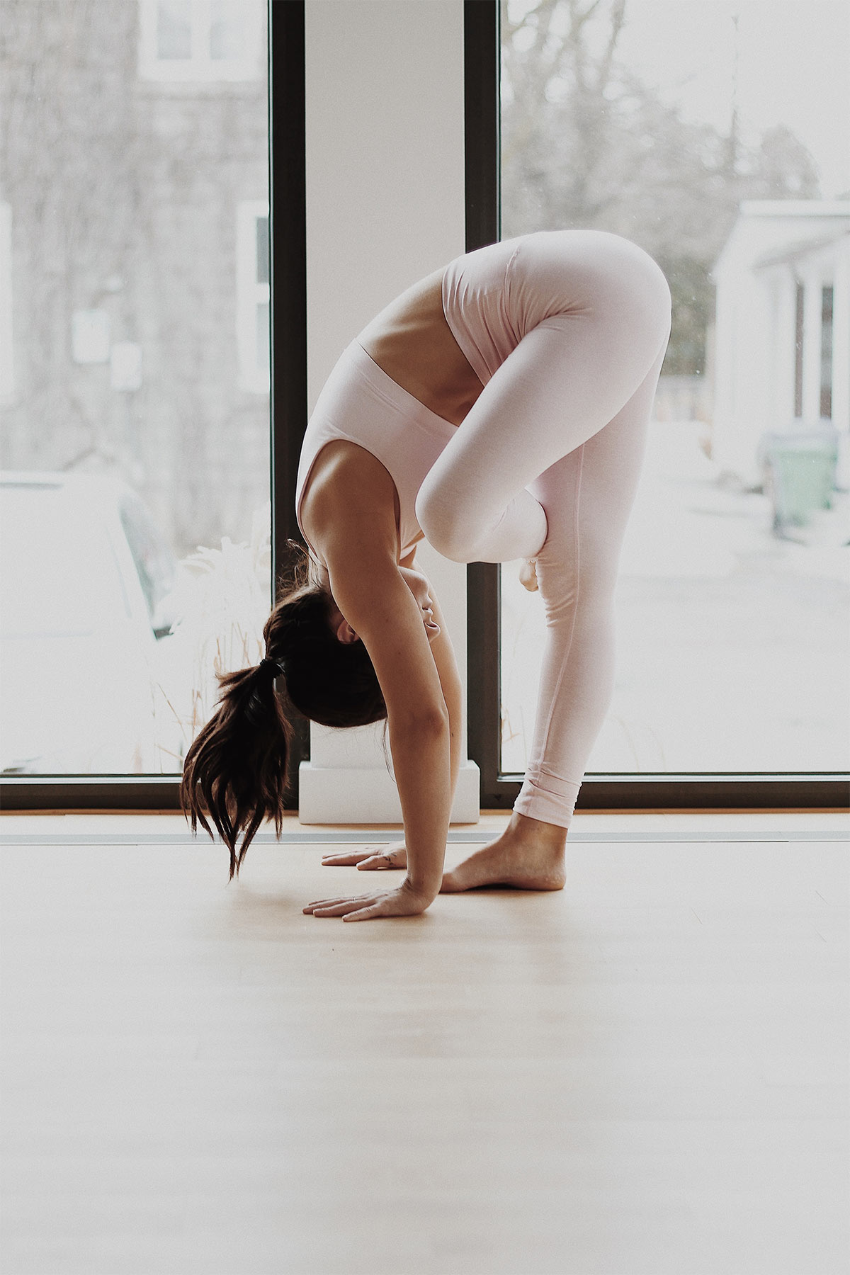 woman doing yoga poses and balancing